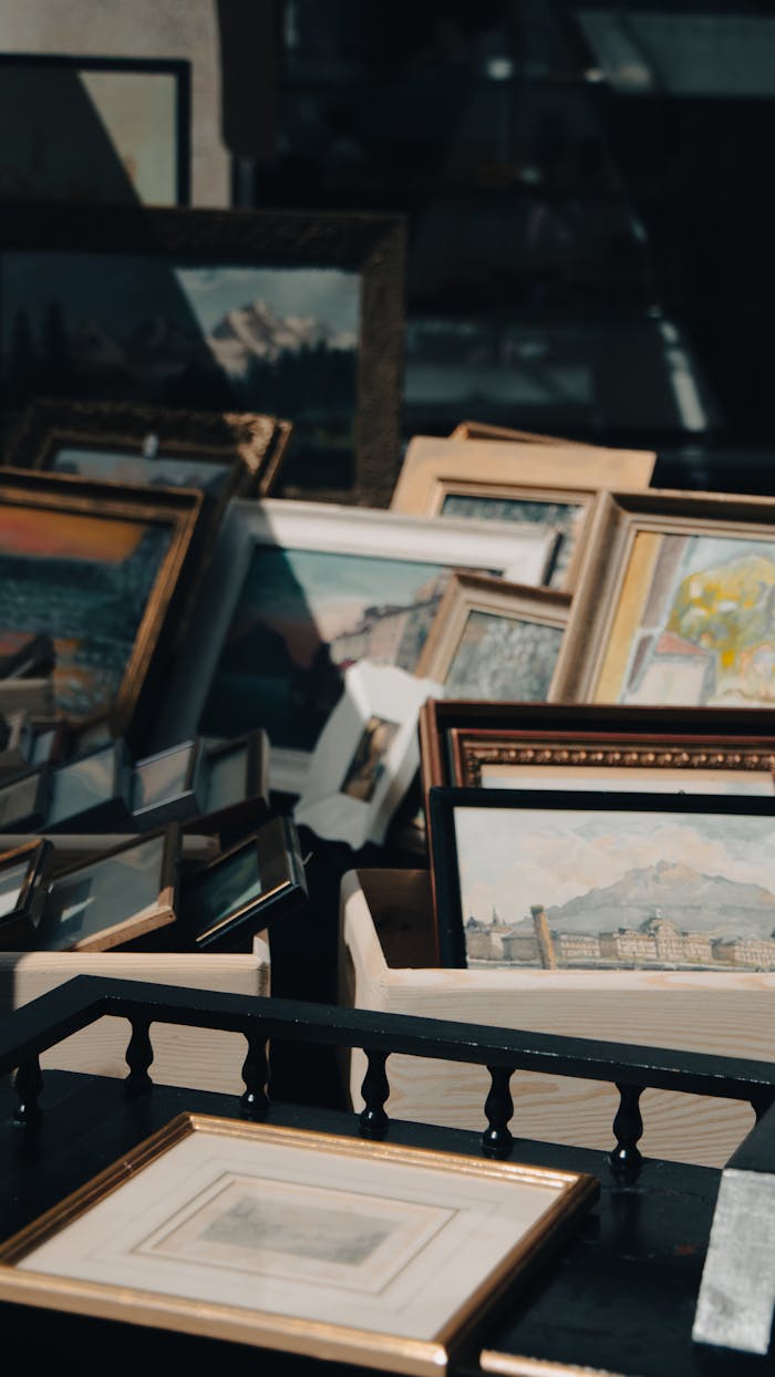gallery-5 A collection of varied framed artworks in a market setting, captured in Zürich, Switzerland.